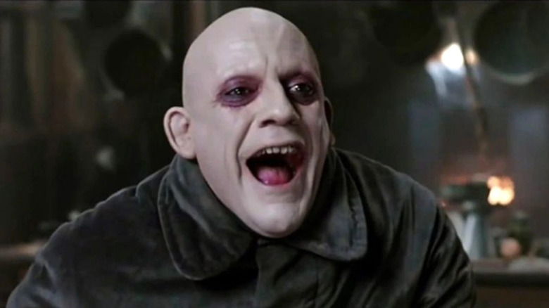 Fester Addams smiles