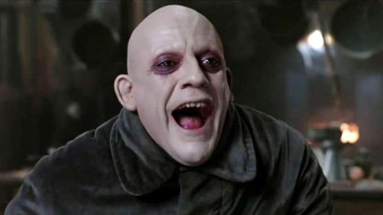 Fester Addams smiles