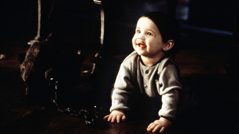 Pubert Addams crawls on the floor