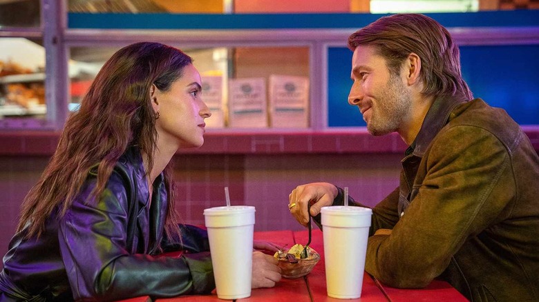 Madison and Gary/Ron eating outside in Hit Man