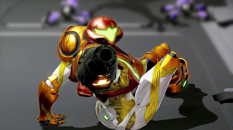 Samus pointing her arm cannon at an enemy while turning on the ground in Metroid Dread