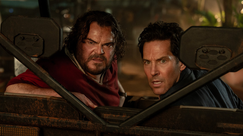 Jack Black as Doug and Paul Rudd as Griff looking back in the golf cart in Anaconda (2025)
