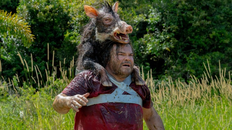 Doug being hugged by a hog in Anaconda
