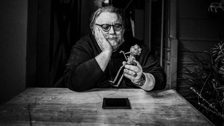 Guillermo del Toro with his Pinocchio stop-motion figure
