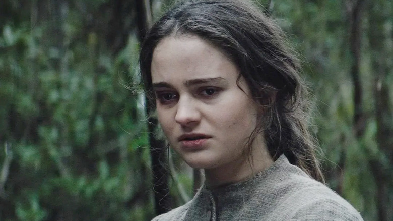 Aisling Franciosi as Clare looking distraught in a forest in The Nightingale (2018)