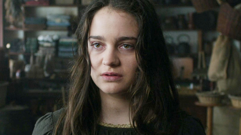 Aisling Franciosi as Clare surrounded by supplies in The Nightingale