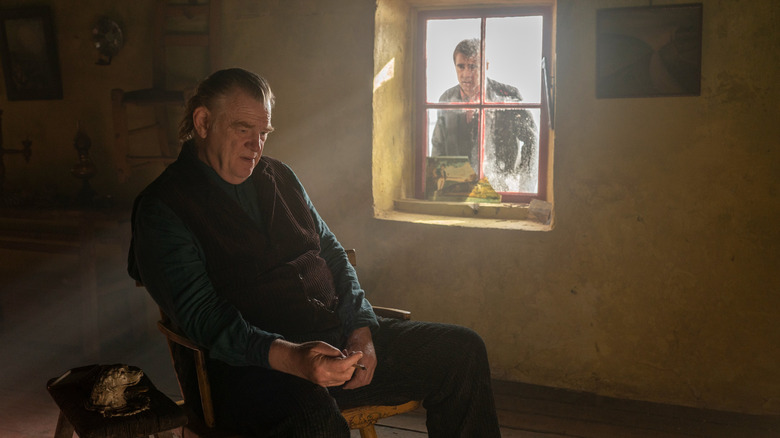 Colin Farrell looks through Brendan Gleeson's window in The Banshees of Inisherin