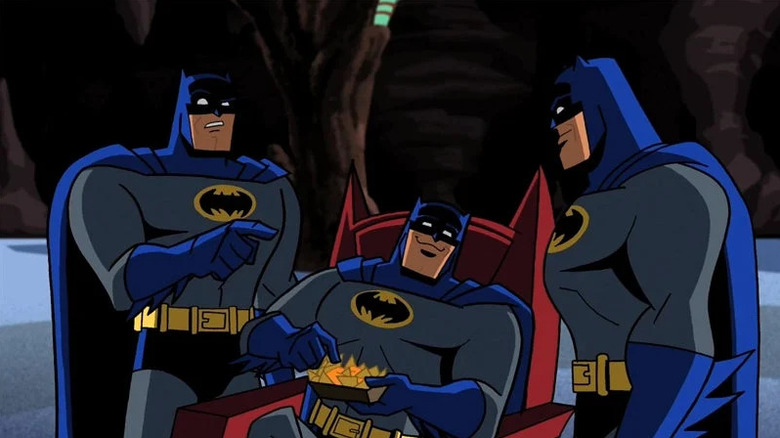 Three Batmen gather in the Batcave in Batman: The Brave and the Bold.