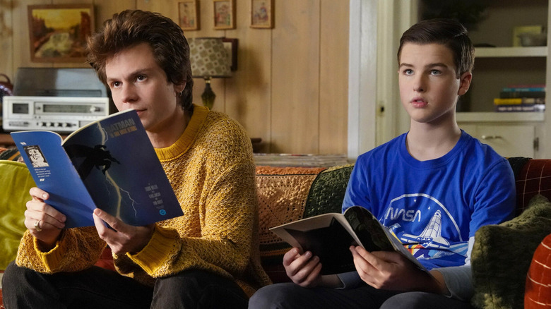 A young Sheldon Cooper and Connor reading Batman comics in Young Sheldon.