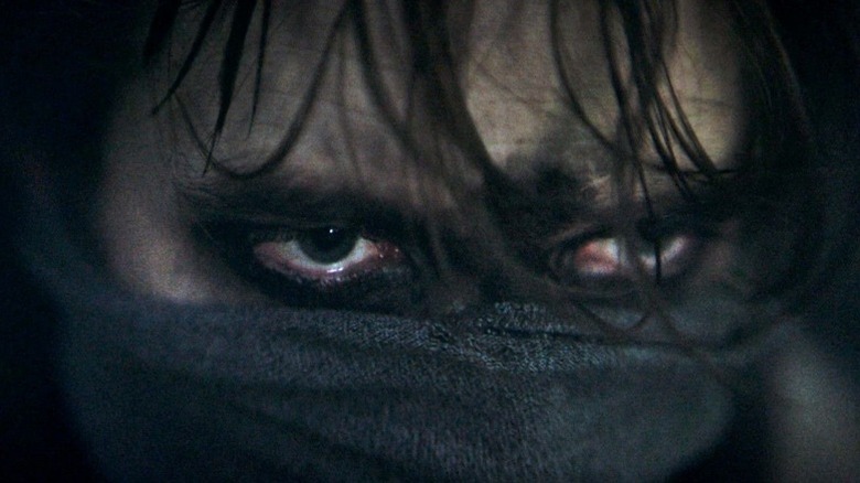 The Batman 2022 close-up of Bruce Wayne's/Batman's eyes covered in black paint