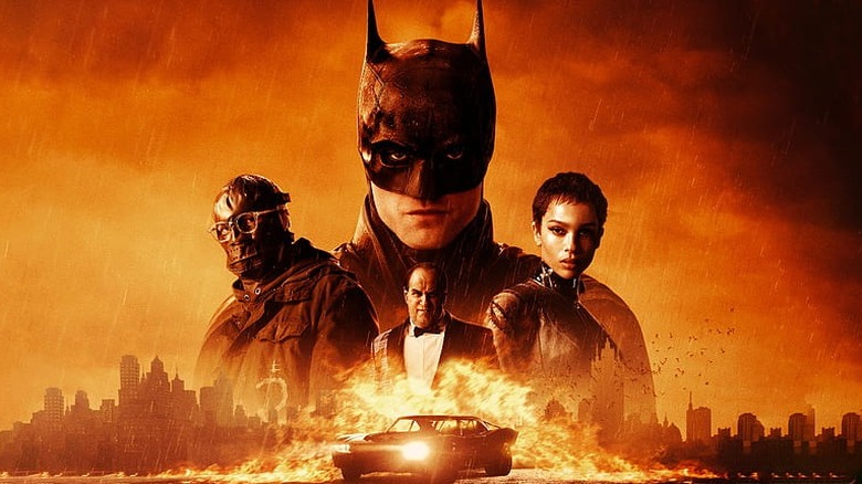 The Batman (2022) poster with Batman, Riddler, Penguin, and Catwoman over an orange-filtered Gotham City skyline