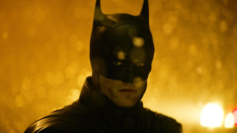 Batman looking grim and sad standing in the snow in a camera test for The Batman: Part II