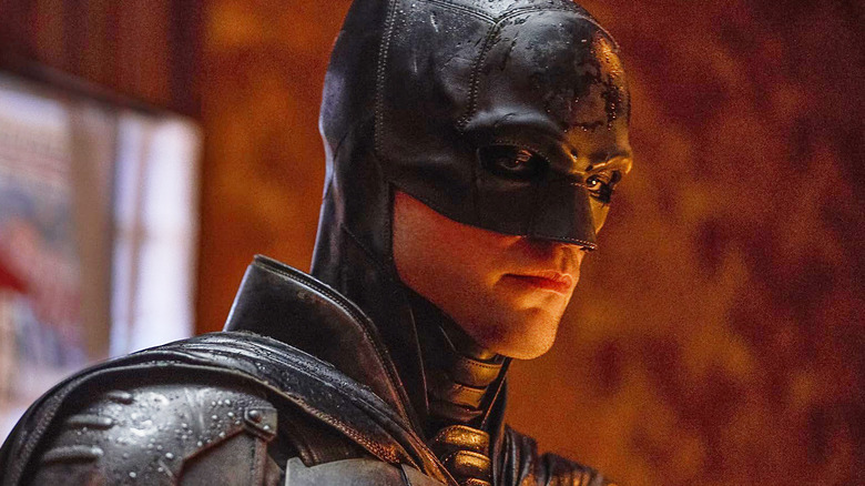 Robert Pattinson as Bruce Wayne wearing his Batman mask and suit in The Batman