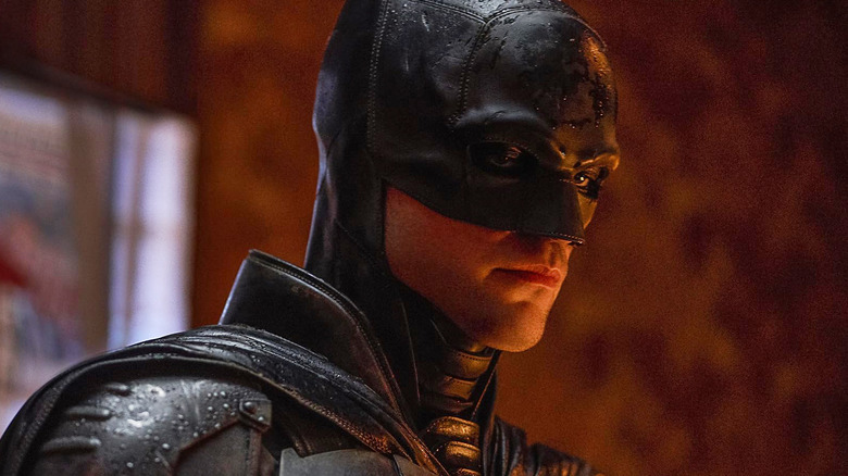 Robert Pattinson as Bruce Wayne wearing his Batman mask and suit in The Batman