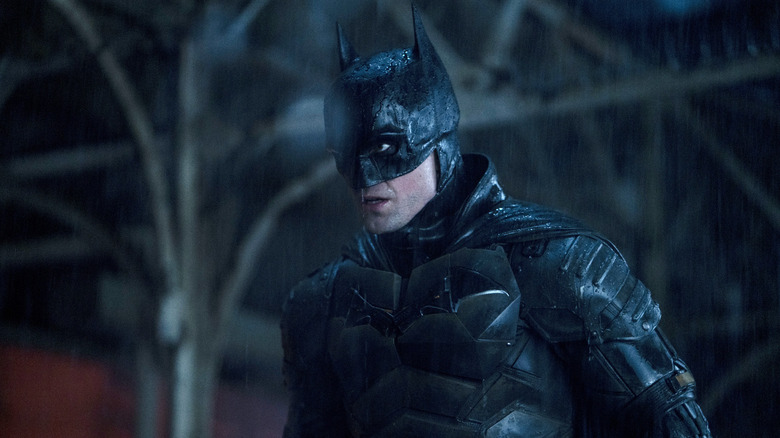 Robert Pattinson in the rain in The Batman