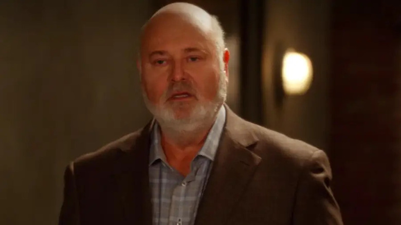 Bob standing in a hallway looking confused on New Girl