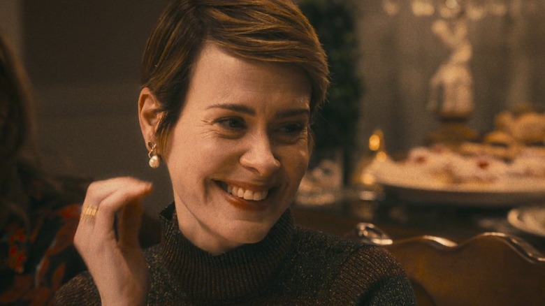 Michelle smiling at Christmas dinner on The Bear