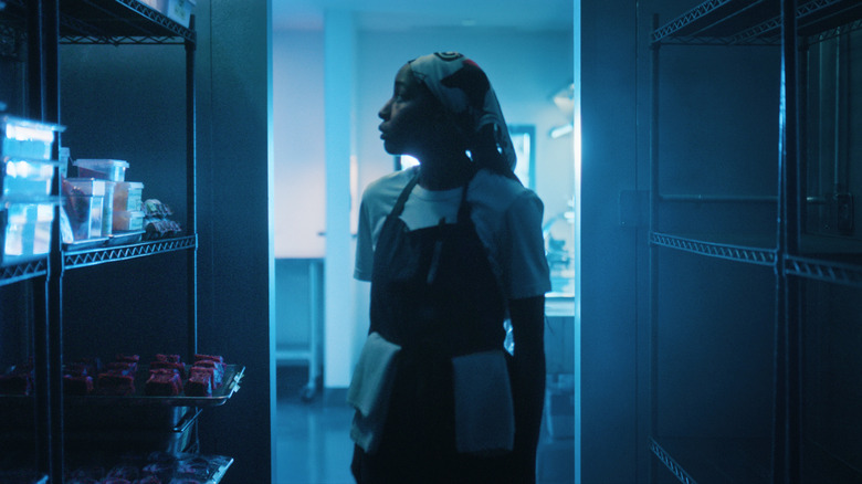 Sydney stands in the walk-in freezer in The Bear Season 5
