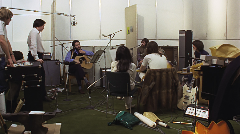men sitting at instruments in a studio
