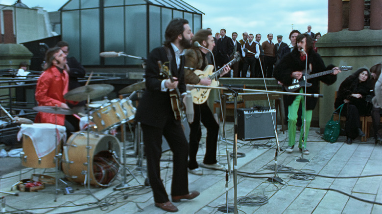 men playing a concert on a rooftop