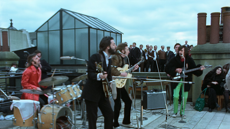 The Beatles playing on the rooftop