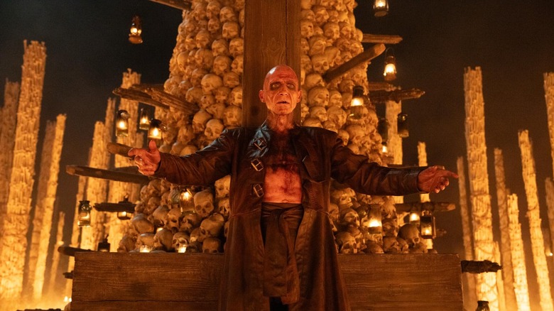 Dr. Kelson stands in front of the Bone Temple in 28 Years Later: The Bone Temple