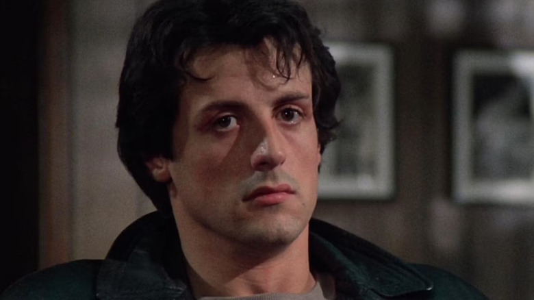 Sylvester Stallone as Rocky Balboa in Rocky, looking deadpan as he looks past the camera.