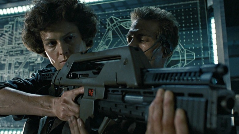 Sigourney Weaver and Michael Biehn preparing for battle
