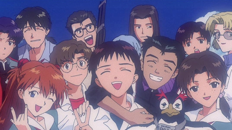 Shinji, Rei and Asuka taking a photo with friends