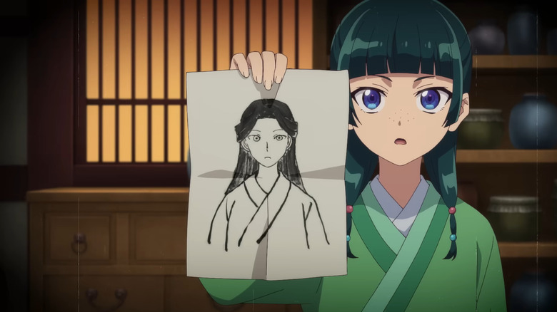 Maomao holds a sketch drawing in her hand in Apothecary Diaries
