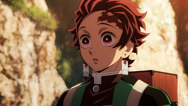 Tanjiro Kamado stares in surprise in Demon Slayer: Kimetsu no Yaiba