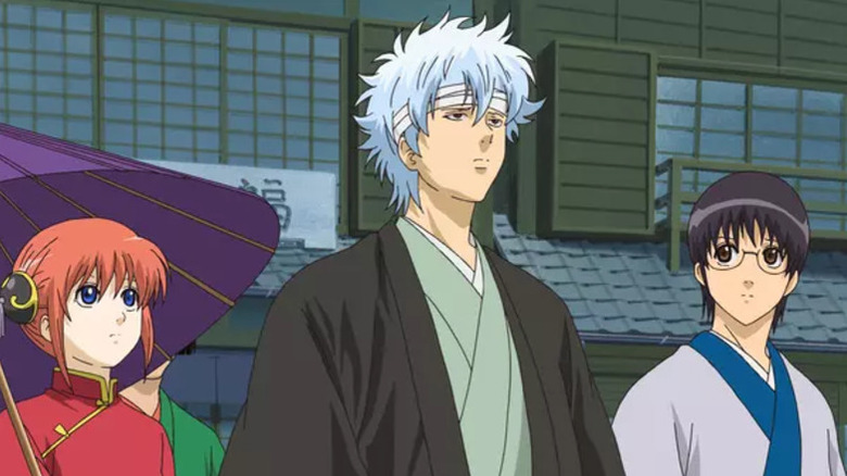 Shinpachi and Kagura glance at Gintoki in Gintama