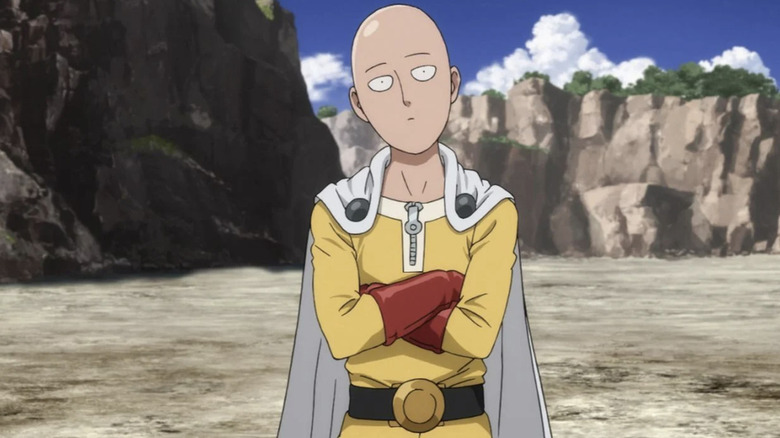 Saitama tilts his head while thinking in a canyon in One-Punch Man