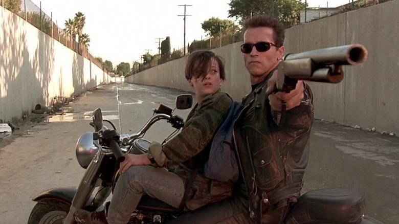 Schwarzenegger protects John with shotgun in Terminator 2: Judgment Day