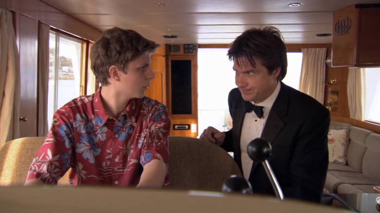 Jason Bateman as Michael talking to Michael Cera as George on a boat in Arrested Development