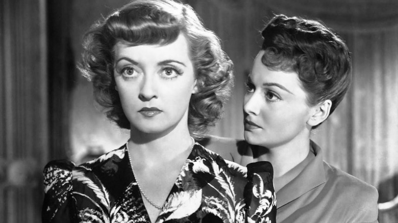 Bette Davis and Olivia de Havilland glaring