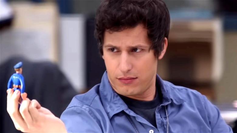 Jake Peralta holding a police figurine
