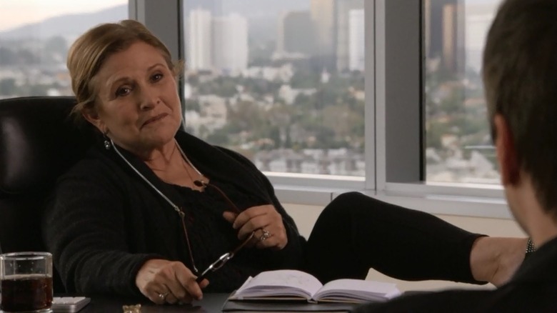 Angela McKinnon sitting at desk