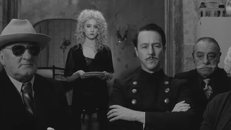 The gang of conspirators looking in "The French Dispatch"