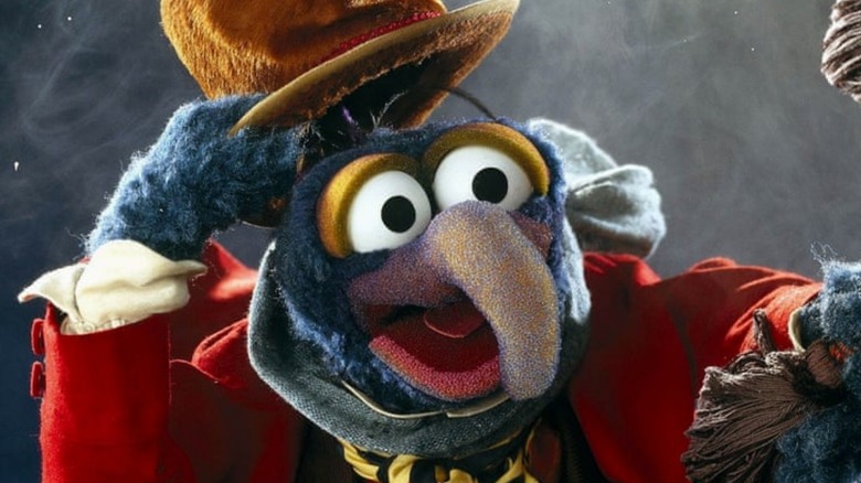 Gonzo as Dickens tips his cap Muppets Christmas Carol