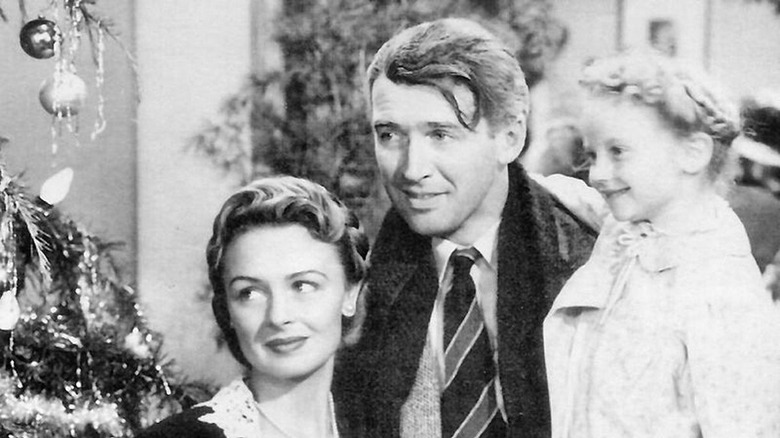 Jimmy Stewart smiles with family