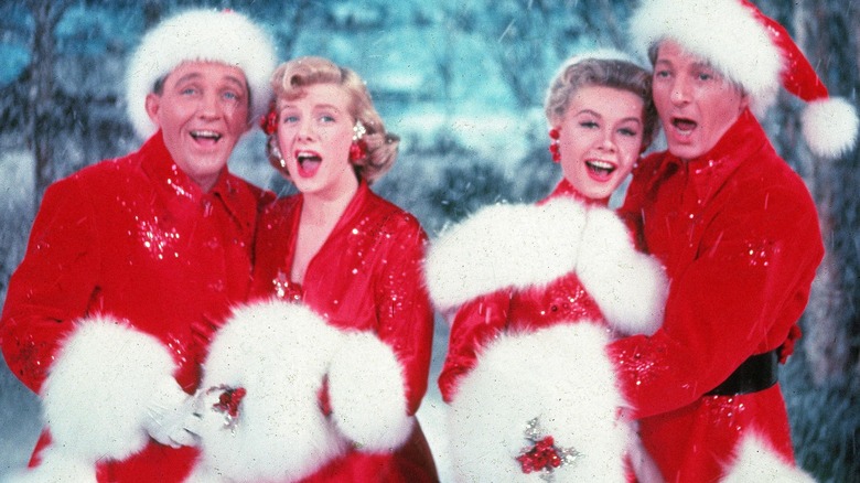 Two couples in Santa outfits