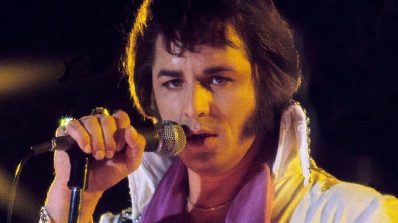 Don Johnson singing into the microphone as Elvis in Elvis and the Beauty Queen