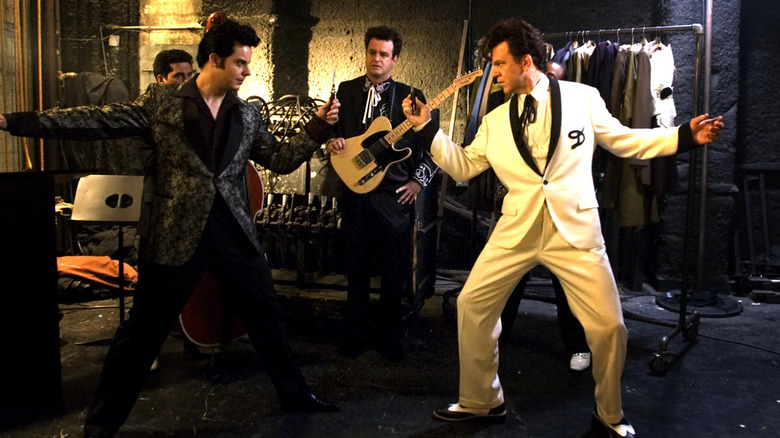 Jack White as Elvis and John C. Reilly as Dewey Cox facing off in Walk Hard: The Dewey Cox Story
