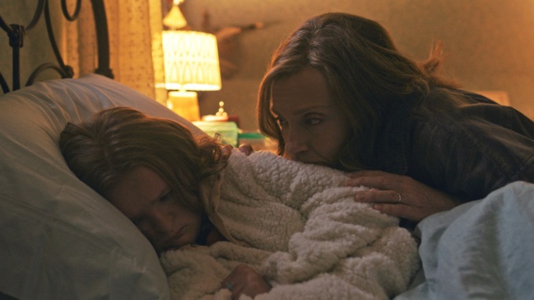 Charlie's mother watches over her.