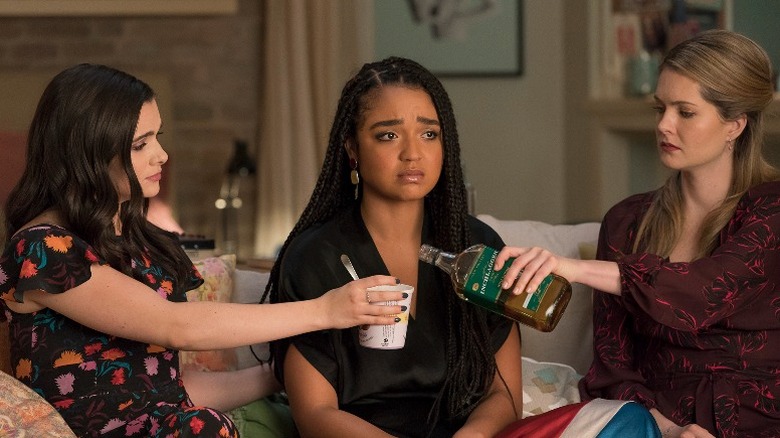 Katie Stevens, Aisha Dee, and Meghann Fahy sitting