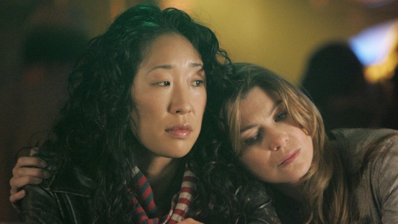 Ellen Pompeo with head on Sandra Oh's shoulder