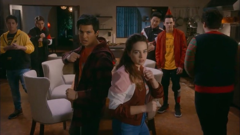 Cast of "Cobra Kai" fighting in the LaRusso house 