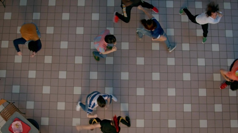 Cast of "Cobra Kai" fighting in the mall 