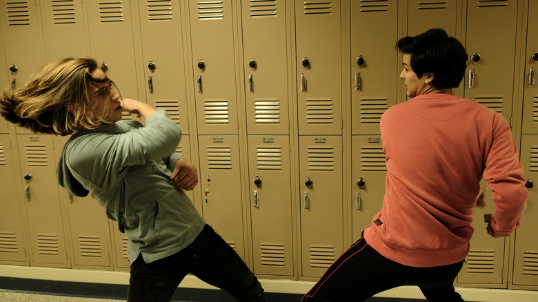 Robby and Miguel fighting in the school in Cobra Kai